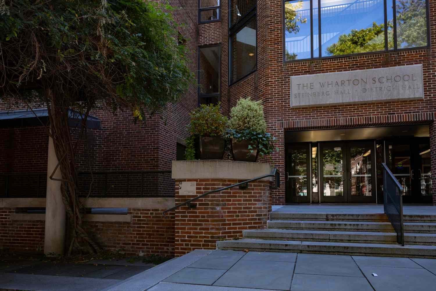 The entrance to the Wharton School’s Steinberg Hall-Dietrich Hall on Penn’s campus, marked by an engraved stone sign.
