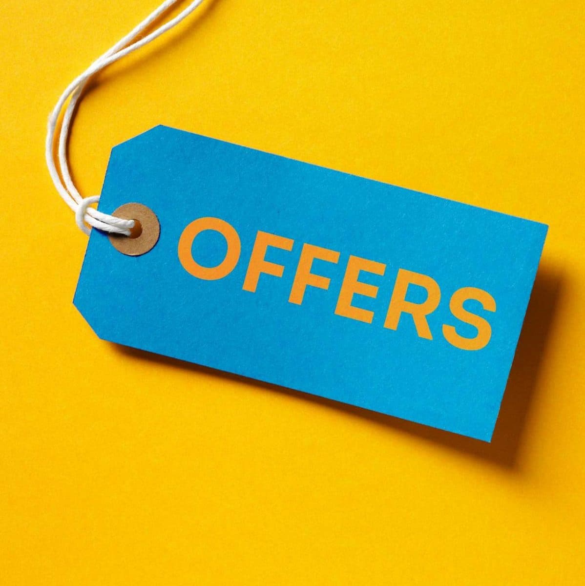 A blue price tag labeled "OFFERS" on a yellow background, representing the financial-aid offers families must carefully evaluate before accepting.